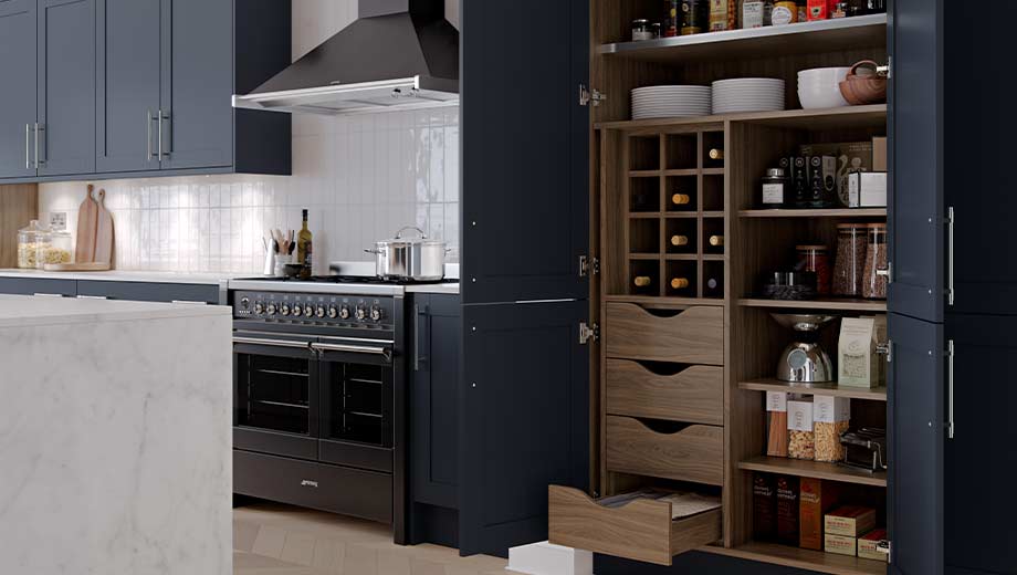 Navy kitchen featuring pantry storage feature