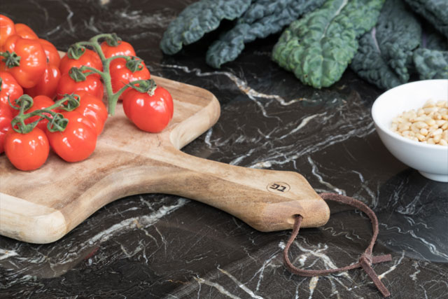 Tomatoes on a chopping board, both from a SpaceTower pantry