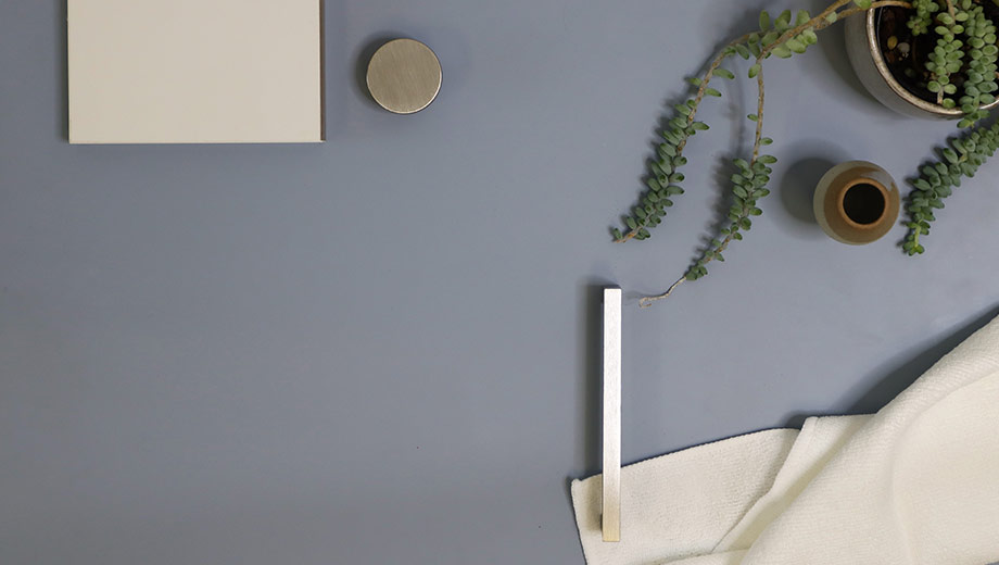 Light blue kitchen with brushed metallic handles