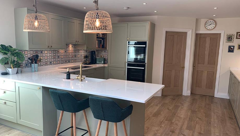 Light green shaker kitchen in Surrey