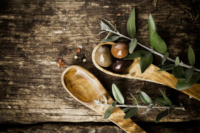 Wooden spoon, herbs and kitchen larder contents