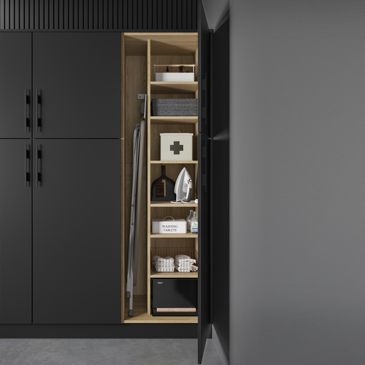 Laundry room cabinet divider insert housed within a black utility cupboard